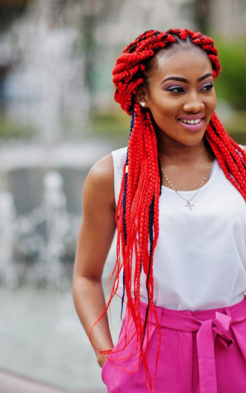 fashionable-african-american-girl-pink-pants-red-dreads-posed-outdoor-against-fountains