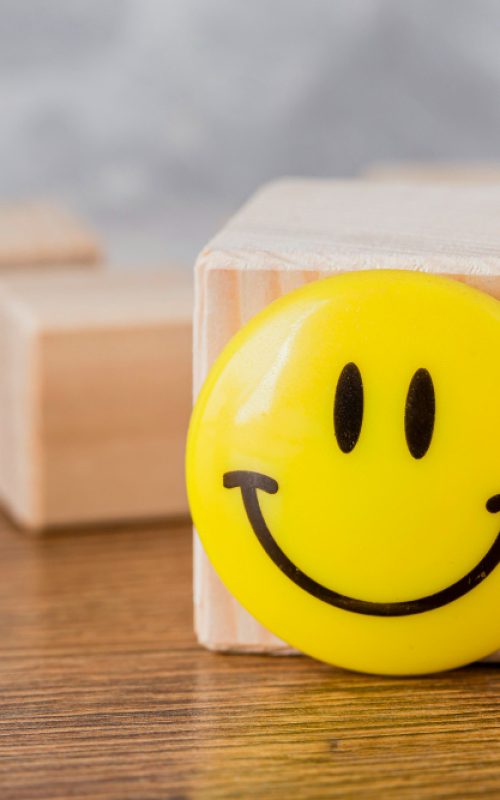 front-view-smiley-face-wooden-block